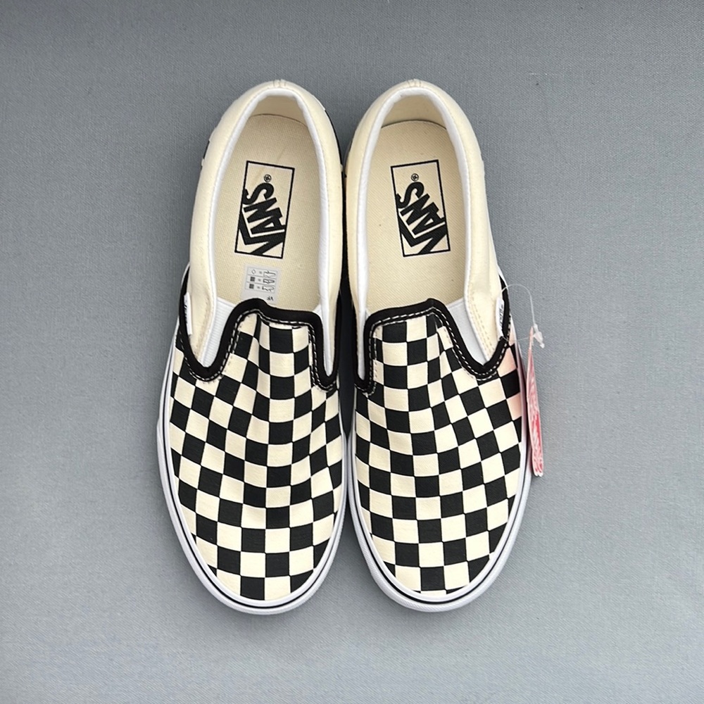 Vans black and white checker board slip on sneakers. Size 8